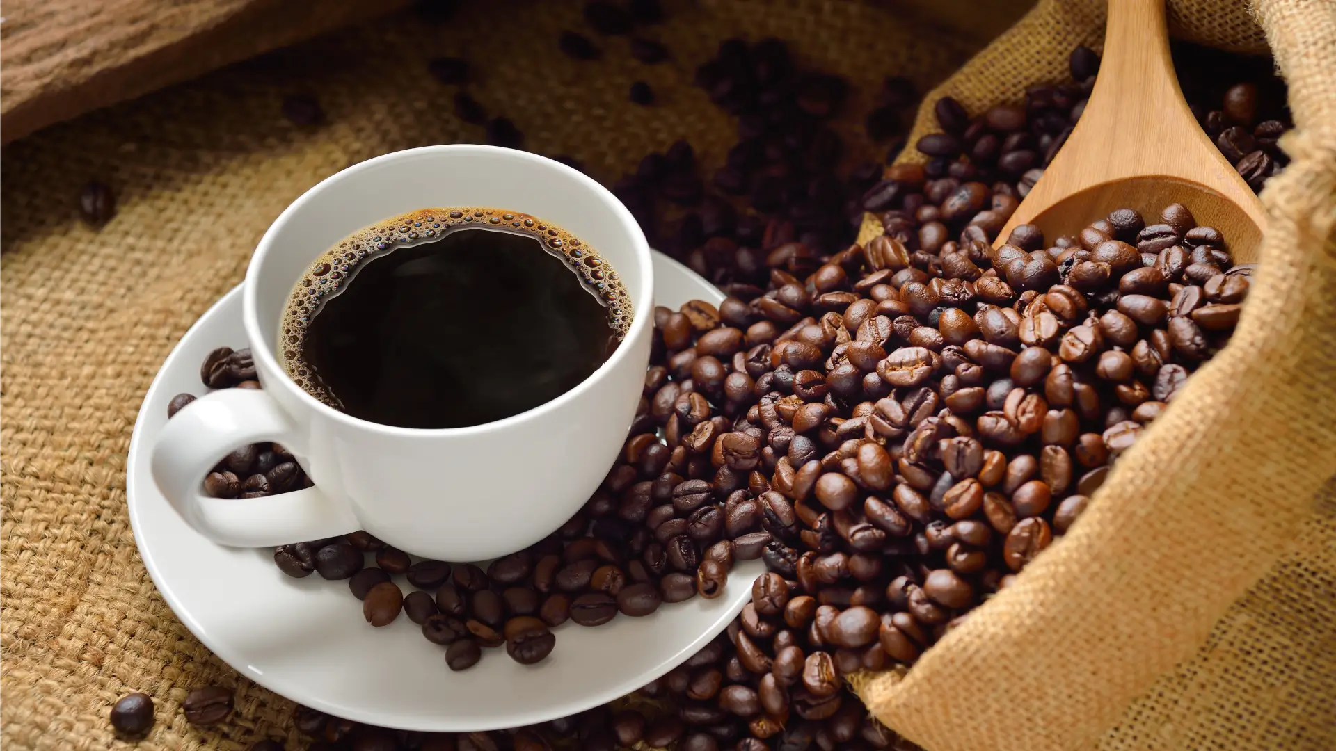 coffee beans spilling on cup