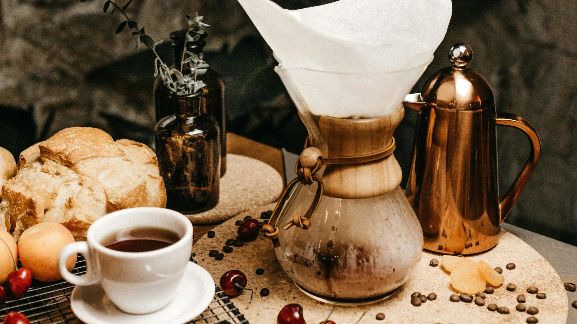 coffee pots with cup of coffee and bread