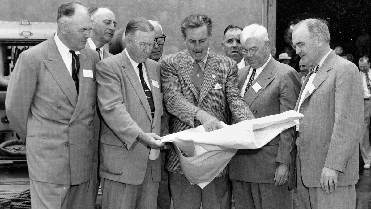 walter disney showing other executives plans for the disney world park