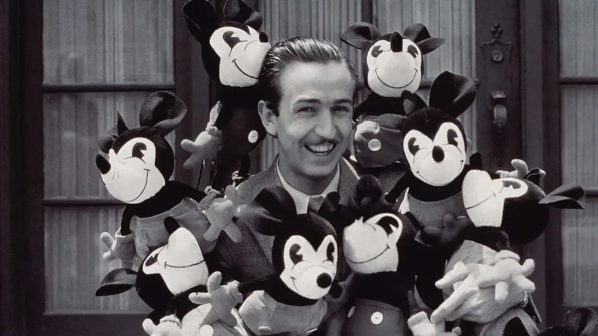 walter disney surrounded by mickey plushies