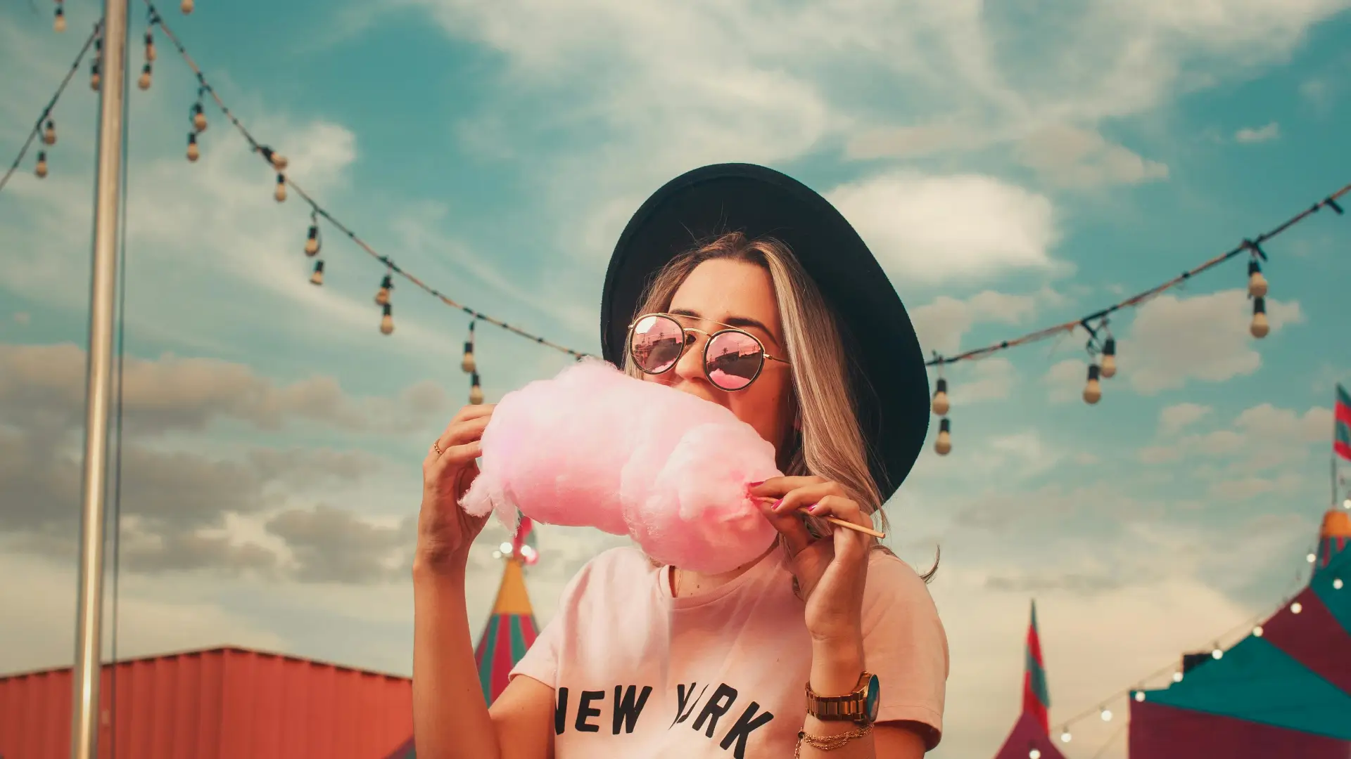 girl eating cotton candy