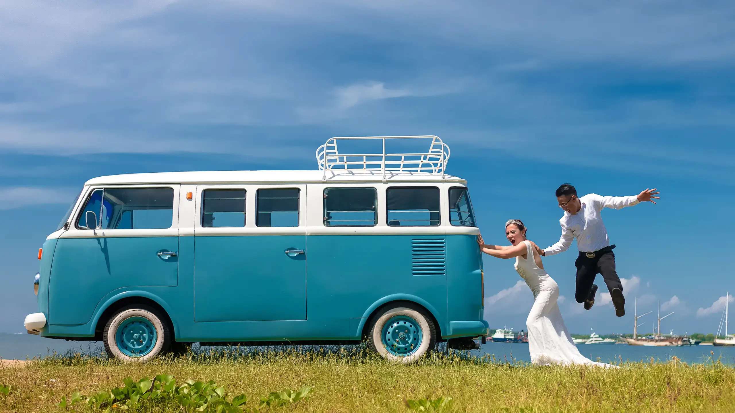 couple next to blue van