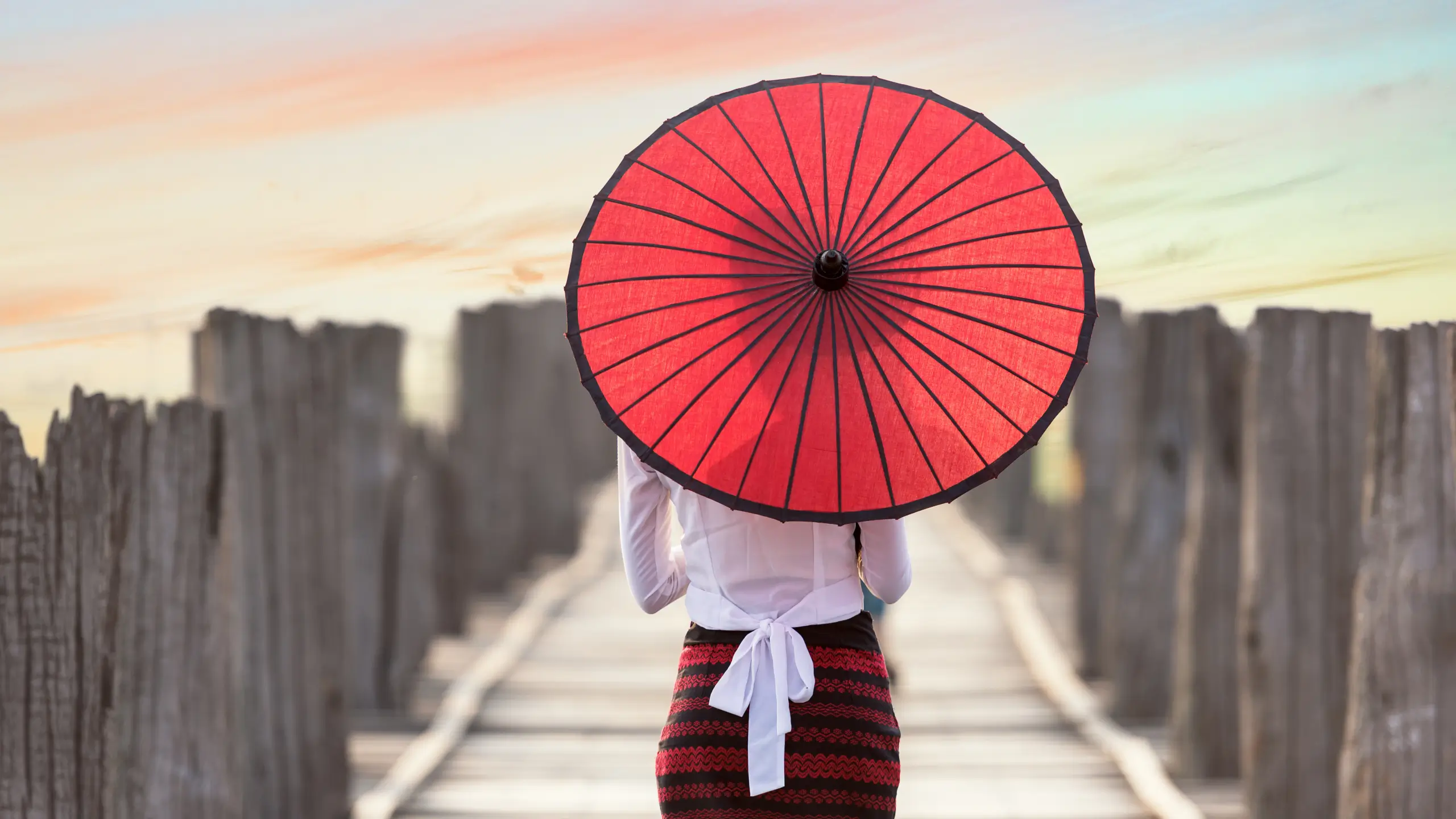 girl holding red umbrella