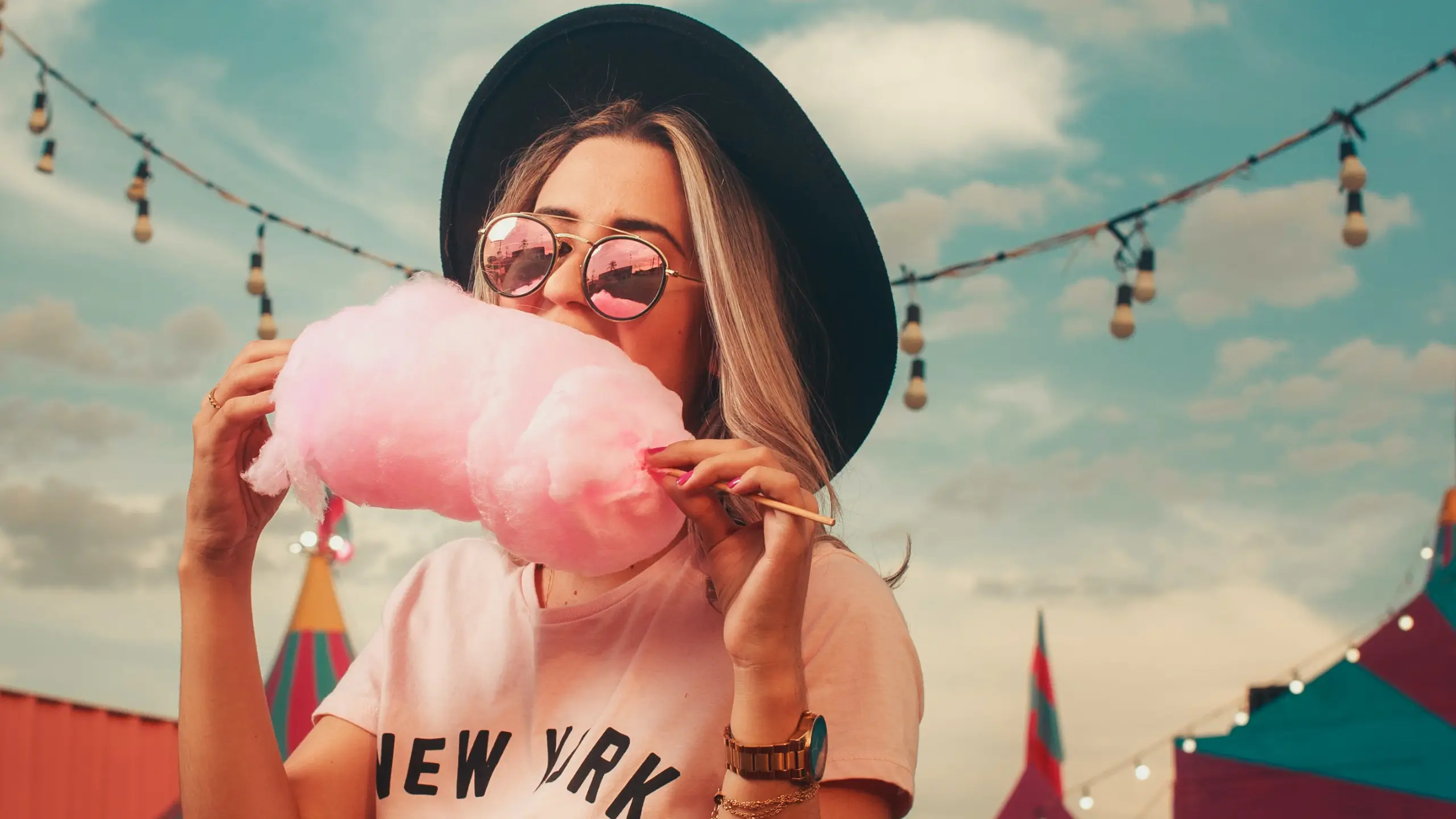 girl eating cotton candy