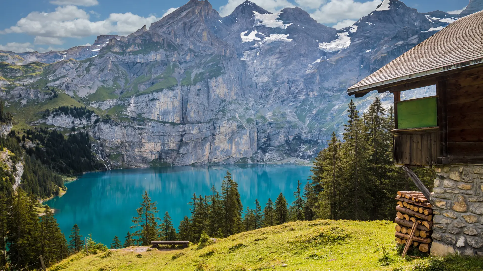 cabin in front of a lake