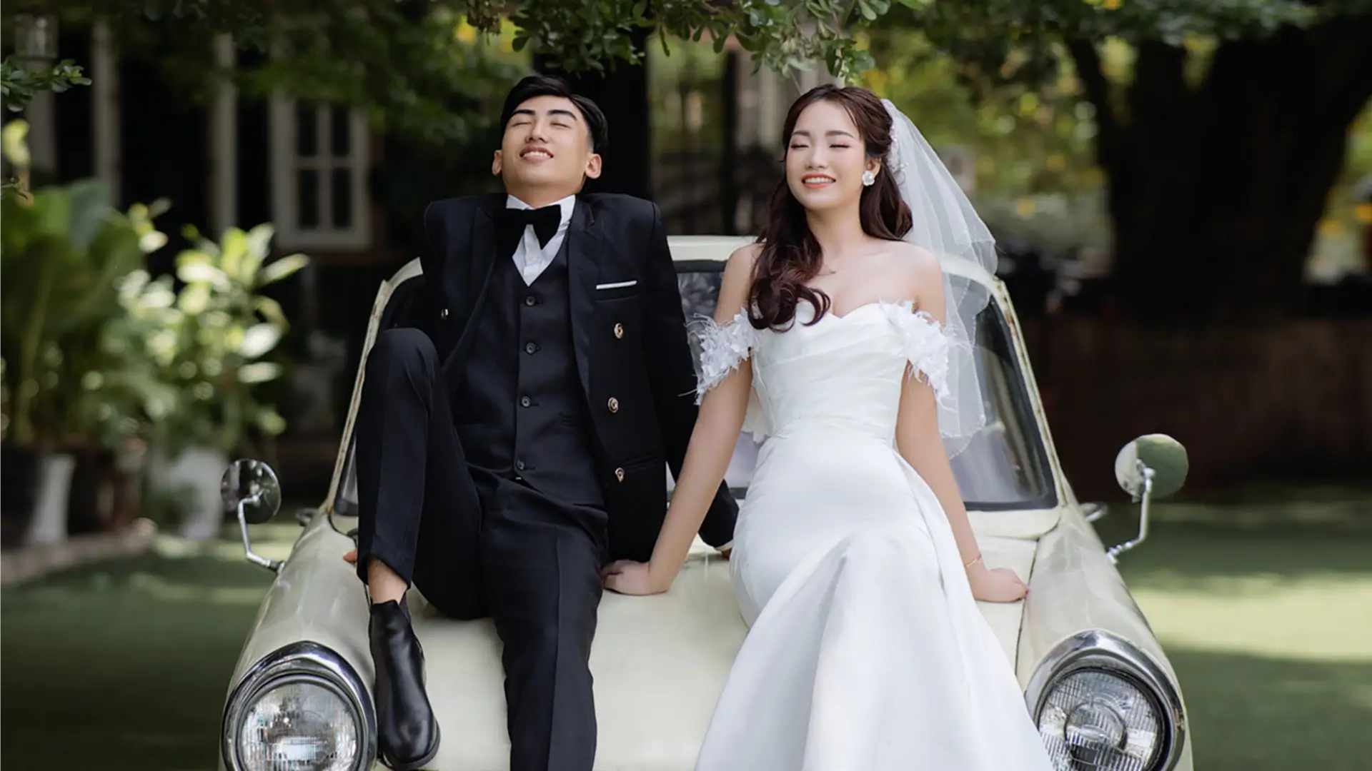 couple on car bonnet