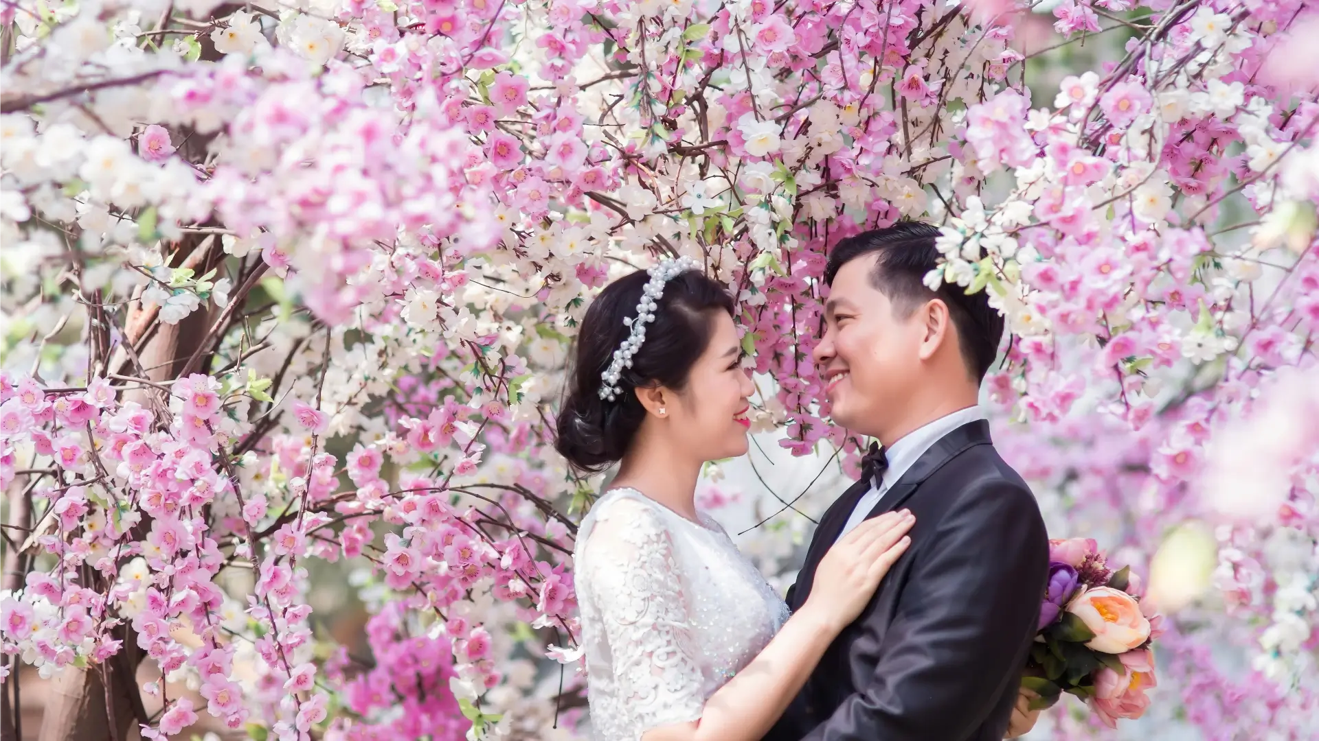 wedding couple under sakura trees
